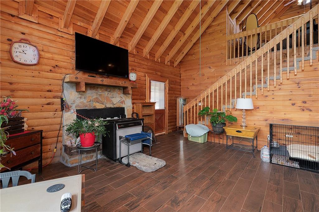 1001 Liberty Church Road Northeast Ranger, GA 30734 - Photo 23 of 40 a living room with furniture a flat screen tv and a fireplace