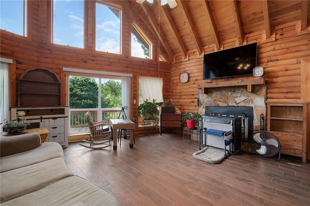 1001 Liberty Church Road Northeast Ranger, GA 30734 - Photo 26 of 40 a living room with furniture a flat screen tv and a fireplace