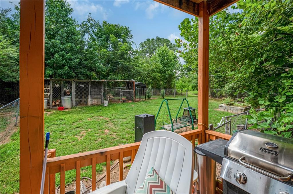 1001 Liberty Church Road Northeast Ranger, GA 30734 - Photo 31 of 40 a view of a deck with a large window and wooden floor