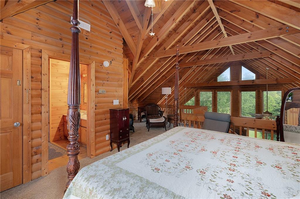 1001 Liberty Church Road Northeast Ranger, GA 30734 - Photo 34 of 40 a bedroom with furniture and large windows