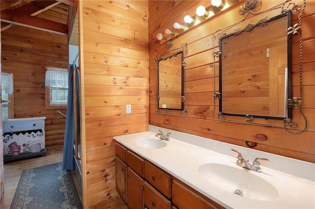 1001 Liberty Church Road Northeast Ranger, GA 30734 - Photo 35 of 40 a bathroom with a sink and a mirror