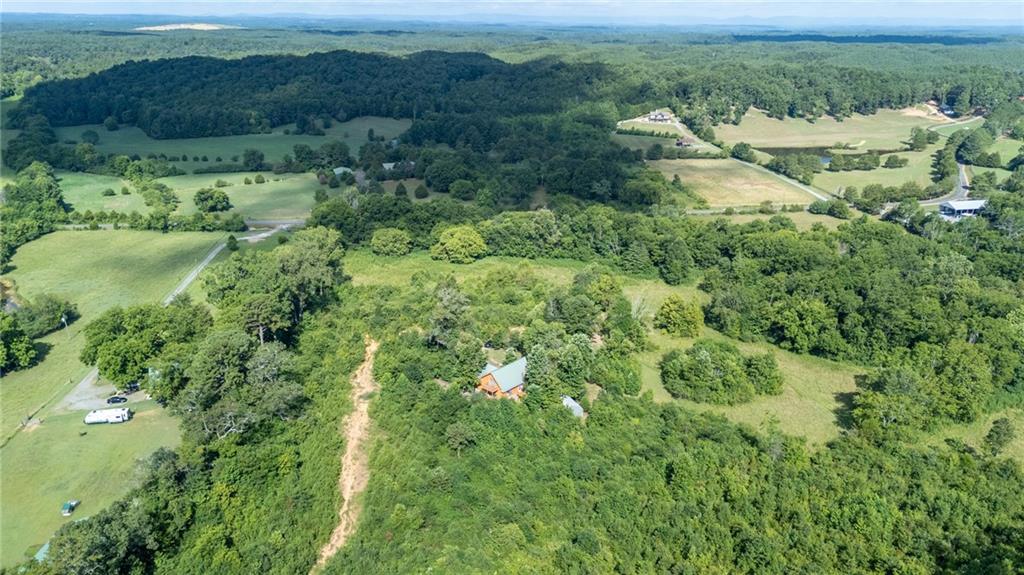 1001 Liberty Church Road Northeast Ranger, GA 30734 - Photo 5 of 40 an aerial view of residential houses with outdoor space and trees all around