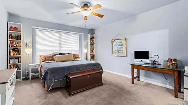 a bedroom with a bed furniture and a window