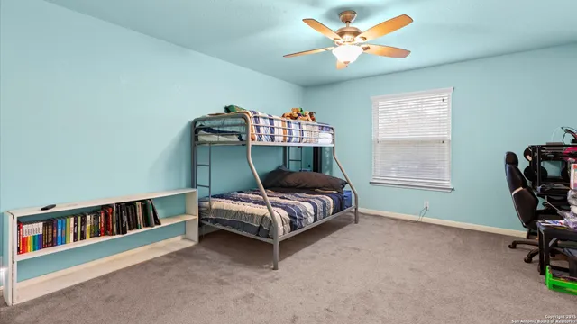 a bedroom with furniture and a window