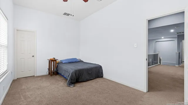 a room with a bed and a mirror