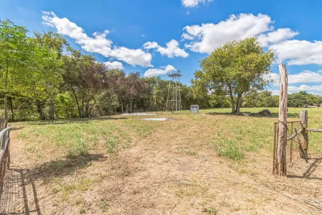 a view of swimming pool with a yard
