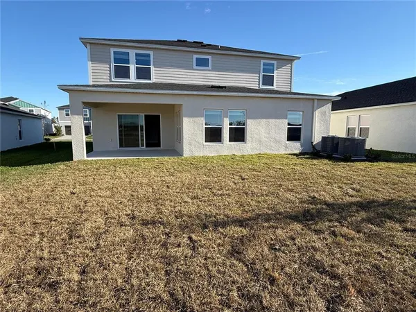 a house that has a big yard in front of it