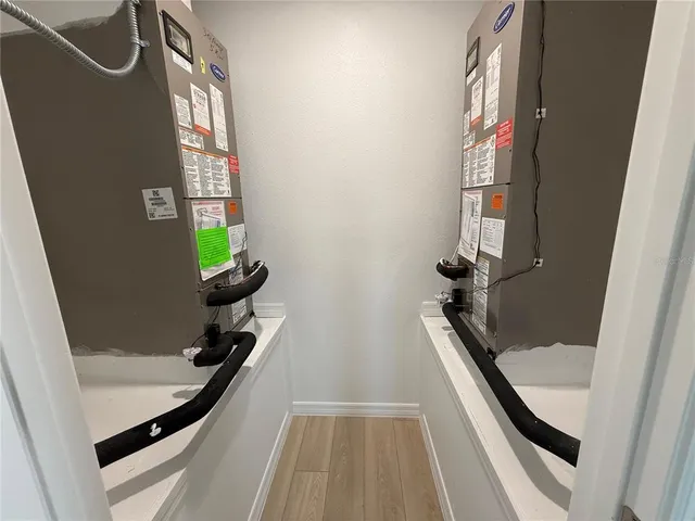 a spacious bathroom with a double vanity sink mirror and shower