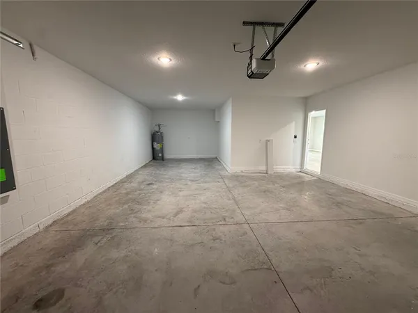 a view of a hallway with wooden floor and a hallway