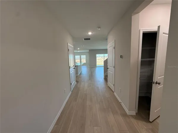 wooden floor in a hall with an entryway