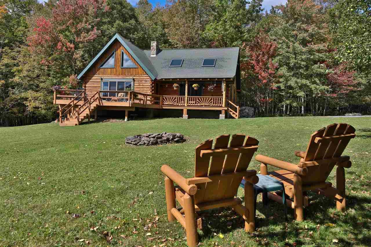 391 Tumbleweed Ranch Road West Kill, NY 12492 - Photo 1 of 35 a view of a chair and table on the garden
