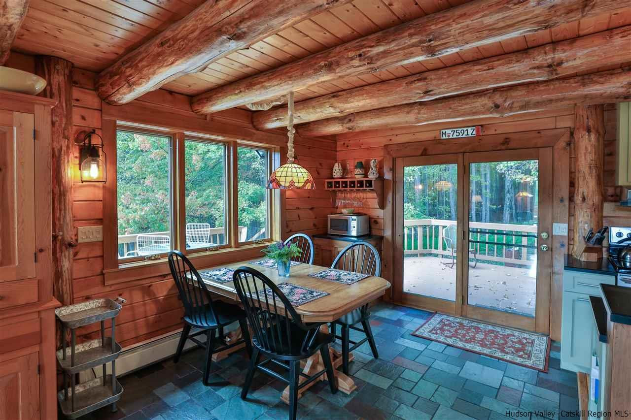 391 Tumbleweed Ranch Road West Kill, NY 12492 - Photo 13 of 35 a living room with furniture and a table