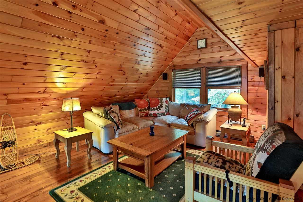 391 Tumbleweed Ranch Road West Kill, NY 12492 - Photo 24 of 35 a backyard of a house with barbeque oven table and chairs