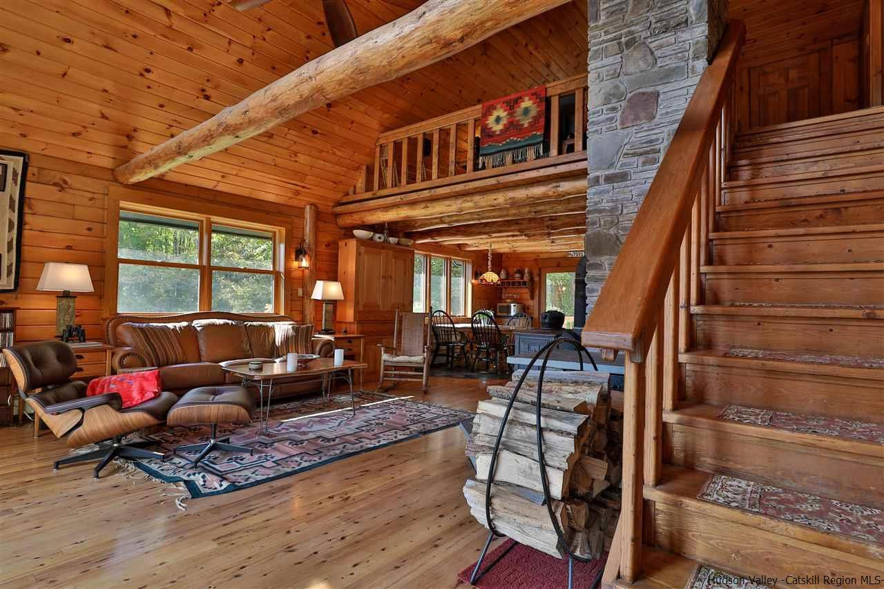 391 Tumbleweed Ranch Road West Kill, NY 12492 - Photo 27 of 35 a living room with furniture wooden floor and large window