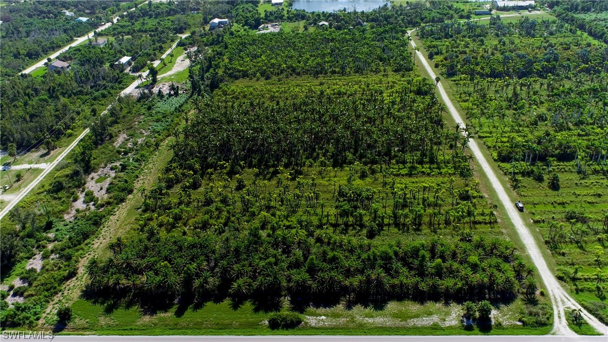 14900 Stringfellow Road Bokeelia, FL 33922 - Photo 12 of 38 a view of yard with green space