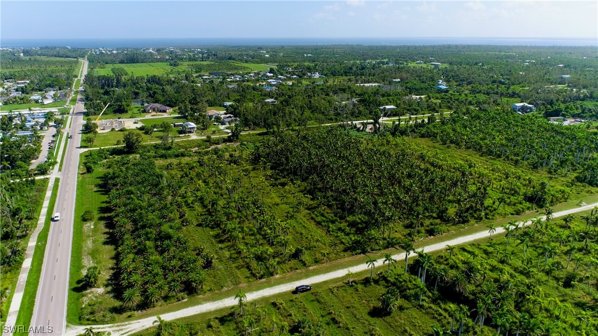 14900 Stringfellow Road Bokeelia, FL 33922 - Photo 30 of 38 a view of a city with lush green forest