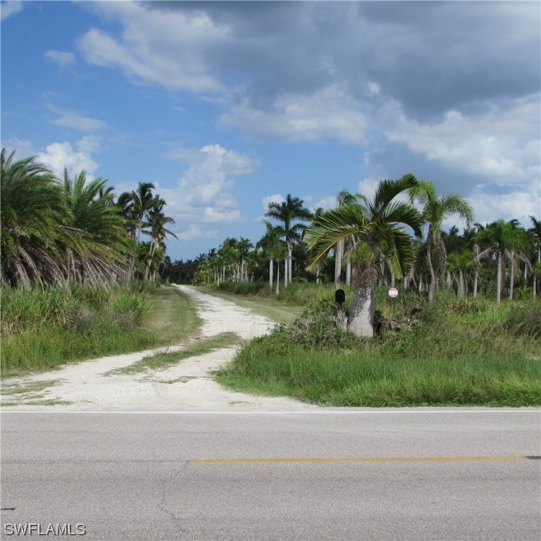 14900 Stringfellow Road Bokeelia, FL 33922 - Photo 4 of 38 a view of a yard and a houses