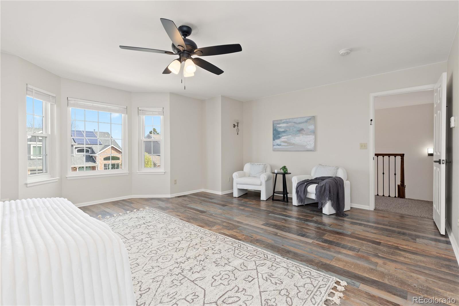 758 Huntington Place Highlands Ranch, CO 80126 - Photo 20 of 46 a bedroom with a bed and wooden floor