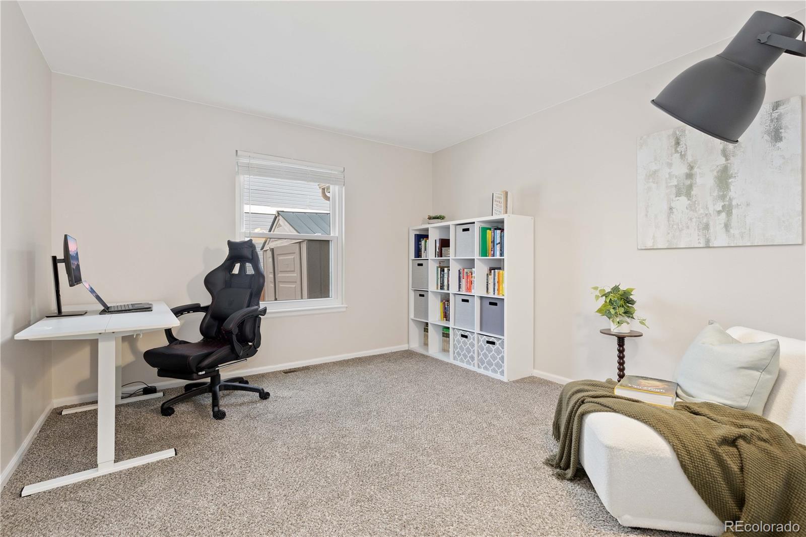758 Huntington Place Highlands Ranch, CO 80126 - Photo 24 of 46 a view of a workspace with furniture and a couch