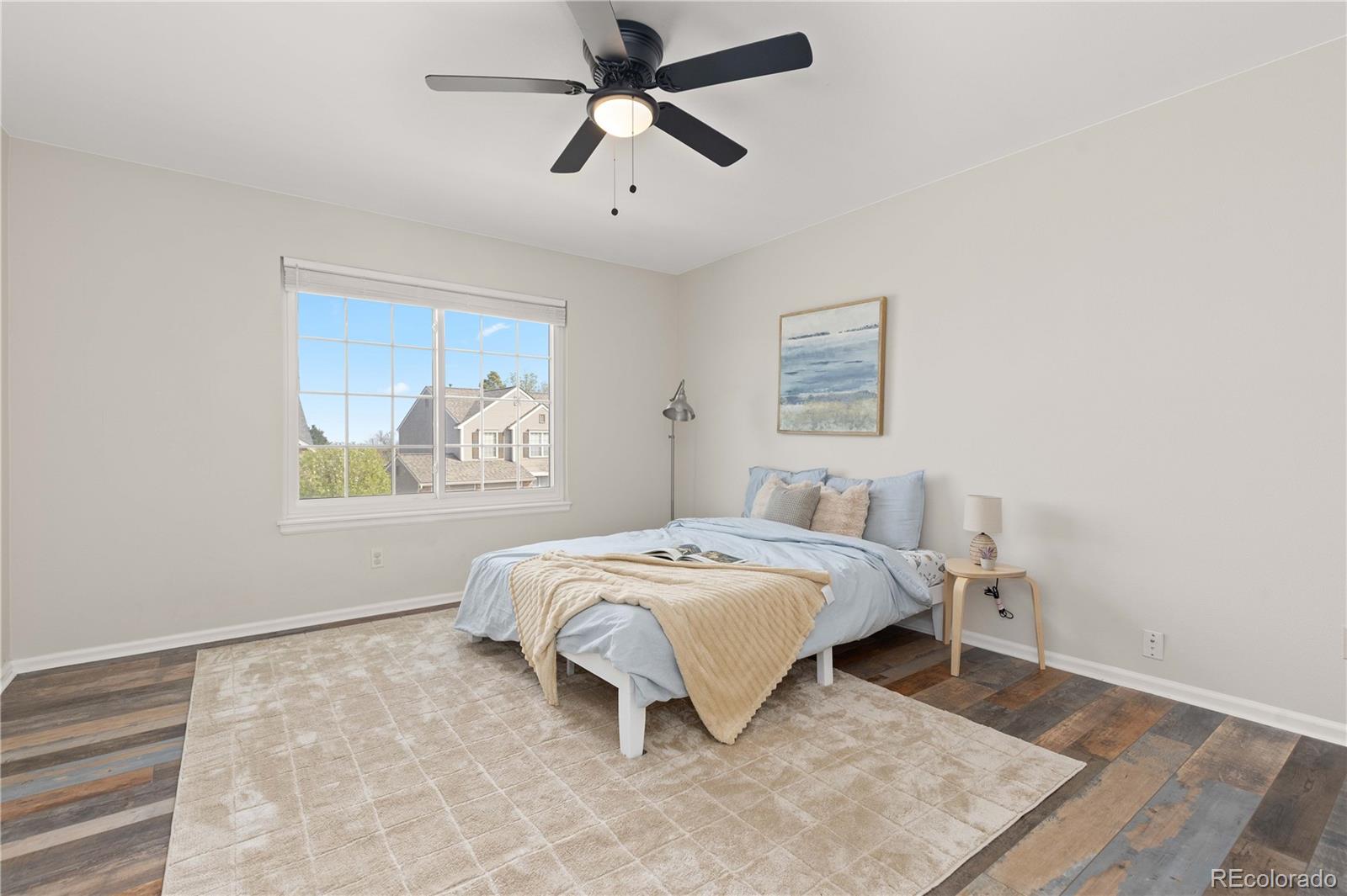 758 Huntington Place Highlands Ranch, CO 80126 - Photo 25 of 46 a bedroom with a bed and a painting on the wall