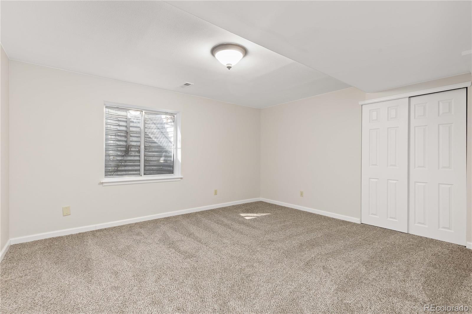 758 Huntington Place Highlands Ranch, CO 80126 - Photo 36 of 46 an empty room with windows