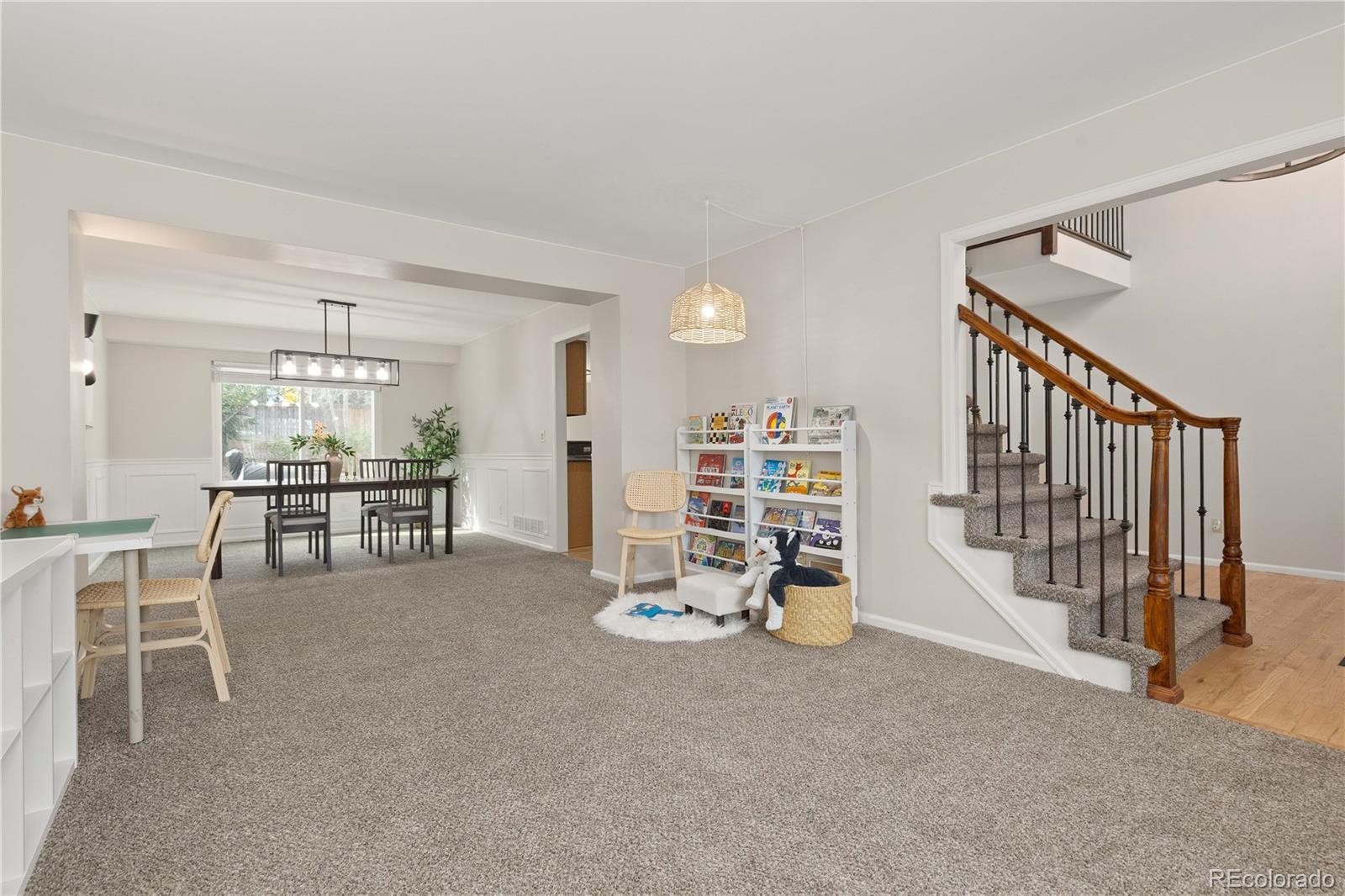 758 Huntington Place Highlands Ranch, CO 80126 - Photo 4 of 46 a view of a livingroom with furniture and staircase
