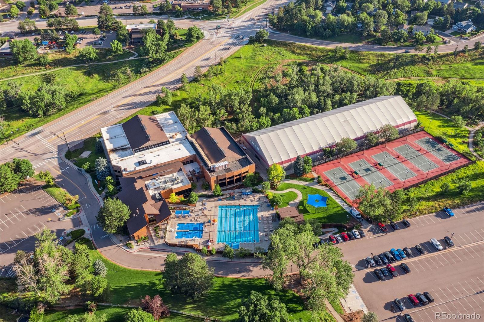 758 Huntington Place Highlands Ranch, CO 80126 - Photo 45 of 46 an aerial view of a house with a garden and lake view
