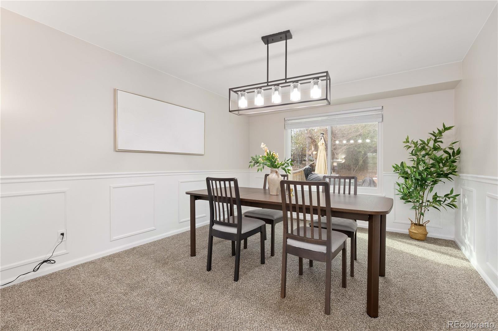 758 Huntington Place Highlands Ranch, CO 80126 - Photo 5 of 46 a view of a dining room with furniture window and wooden floor