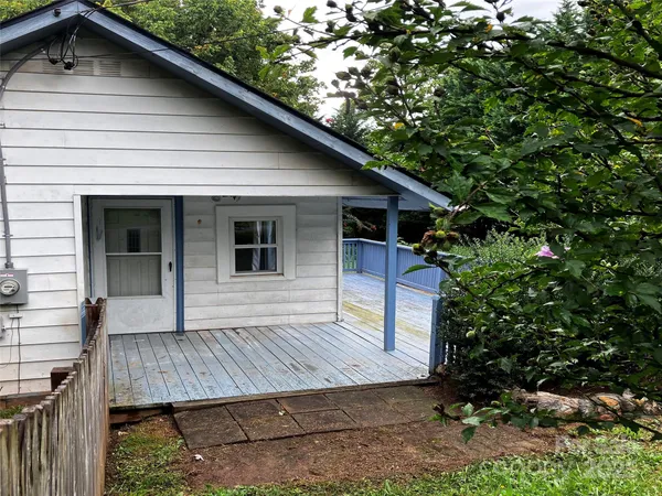 a view of house with roof deck