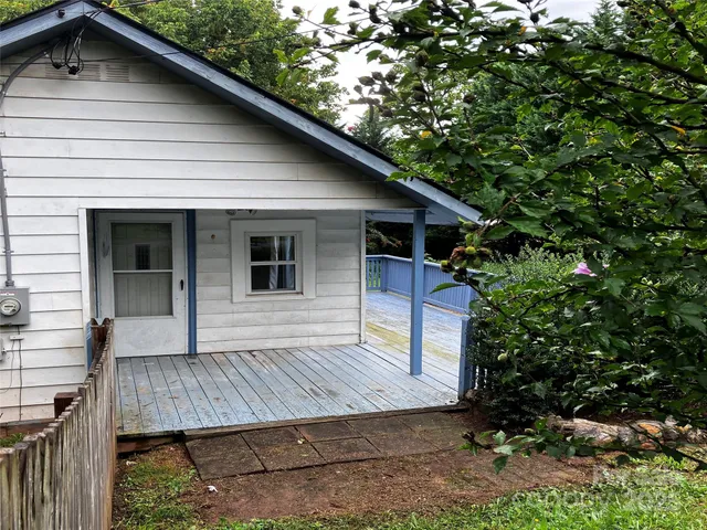 a view of house with roof deck