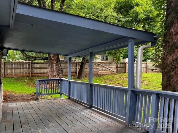 a view of a deck with wooden floor and outdoor space
