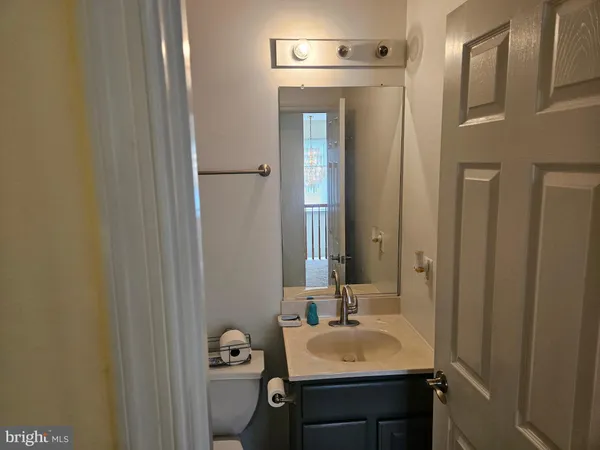 a bedroom with a bed and a television