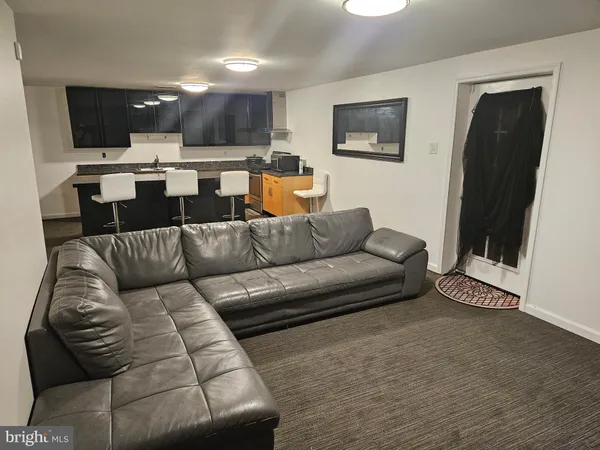 a bedroom with a bed and dresser