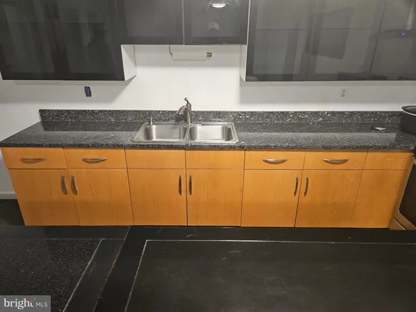 a view of backyard of house with green space