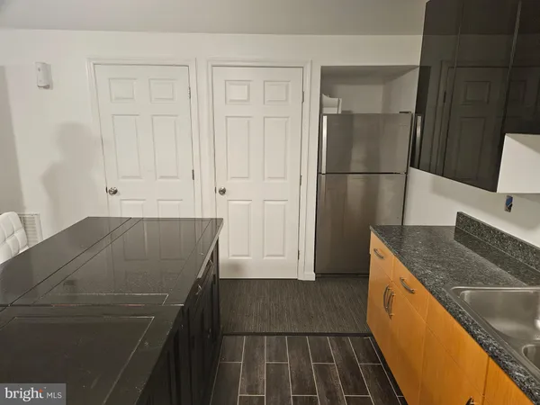 a view of a garden and basketball court