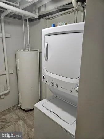 a front view of a house with a large window and a red door