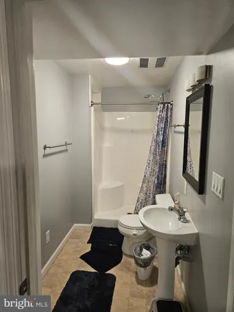 a view of balcony with wooden floor and fence