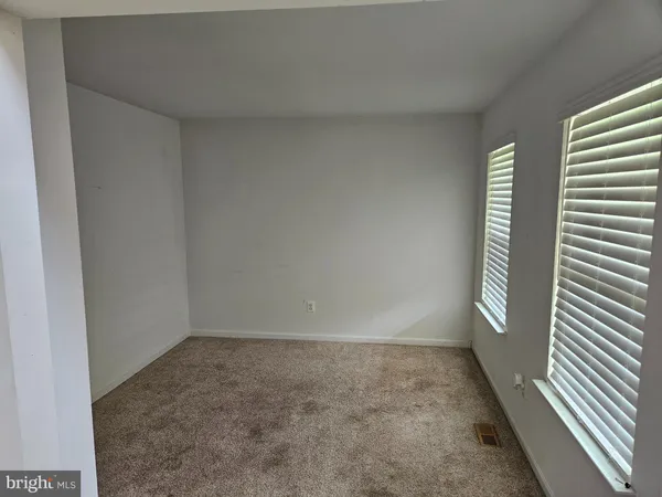 a kitchen that has a lot of cabinets a sink and appliances