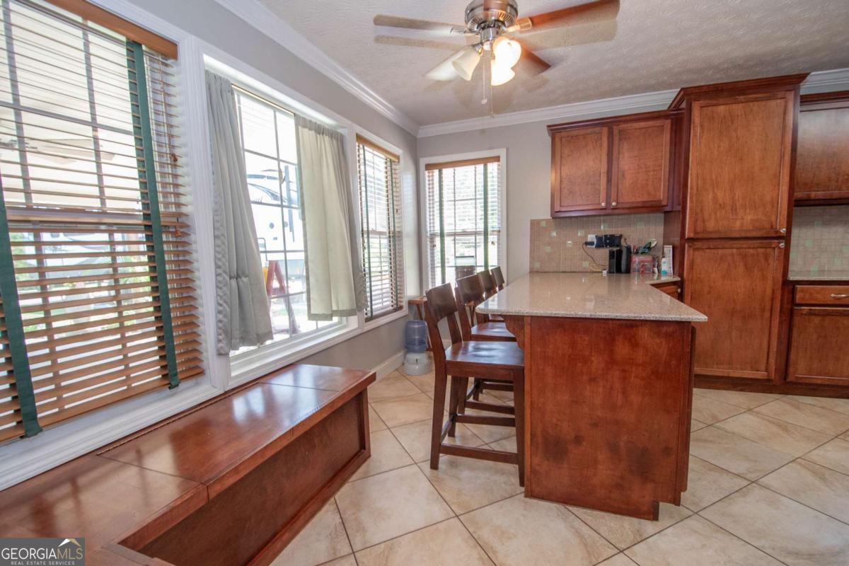 737 John Lovelace Road LaGrange, GA 30241 - Photo 11 of 46 a dining room with granite countertop furniture and a window