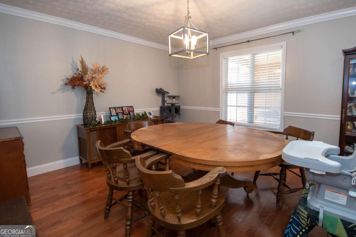 737 John Lovelace Road LaGrange, GA 30241 - Photo 12 of 46 a view of a dining room with furniture and wooden floor