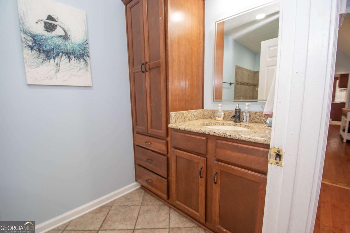 737 John Lovelace Road LaGrange, GA 30241 - Photo 20 of 46 a bathroom with a sink and a mirror
