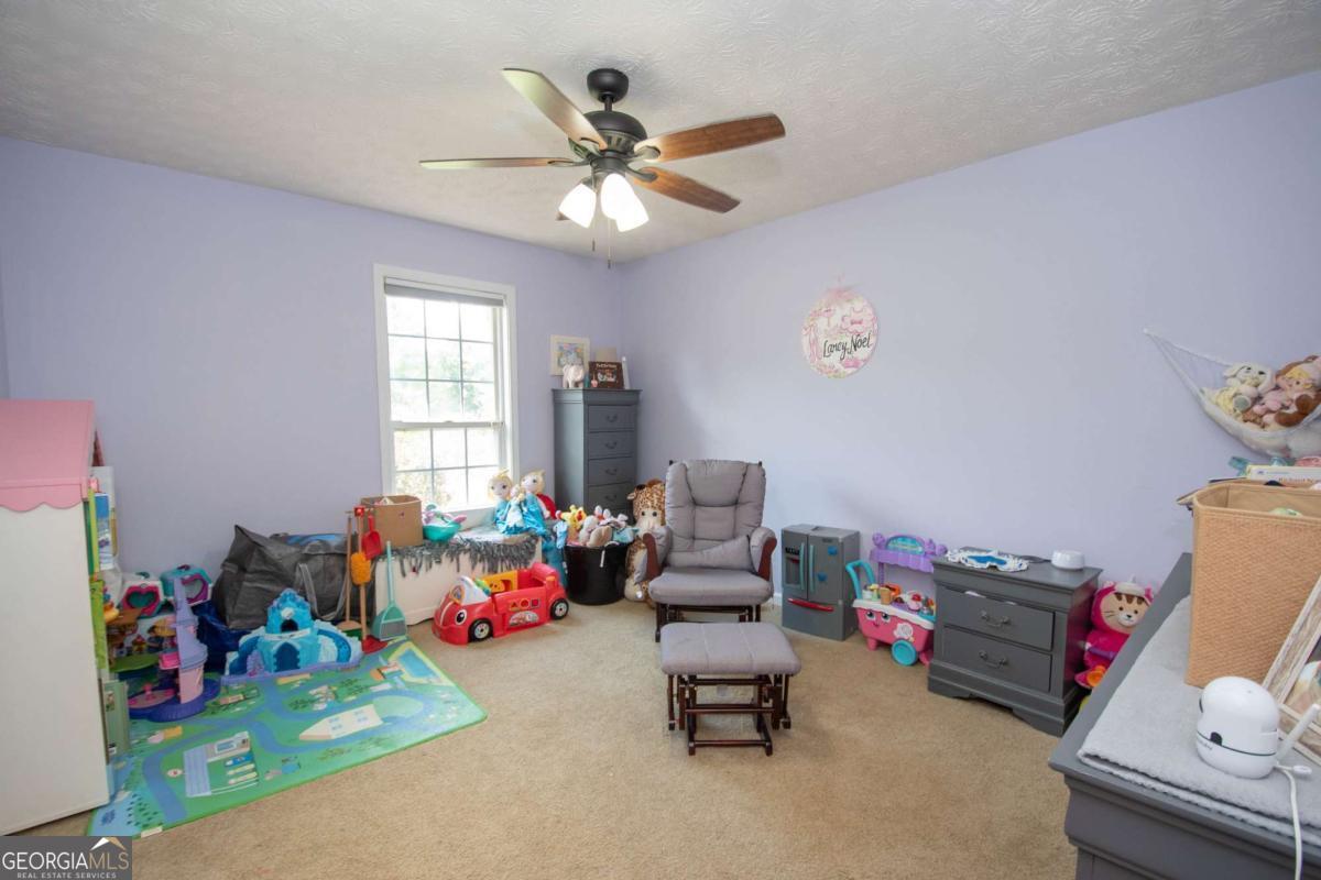 737 John Lovelace Road LaGrange, GA 30241 - Photo 22 of 46 a living room with furniture and a window