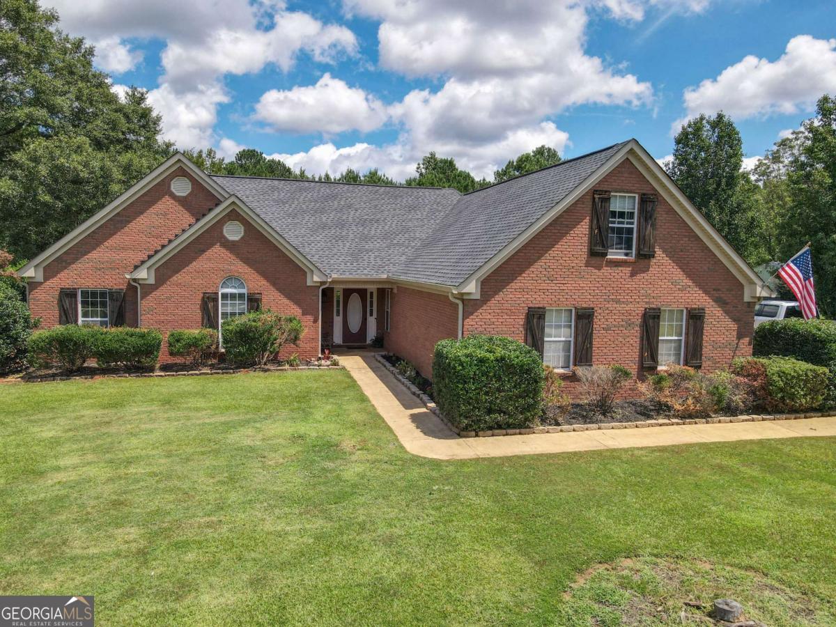 737 John Lovelace Road LaGrange, GA 30241 - Photo 3 of 46 a front view of a house with a yard