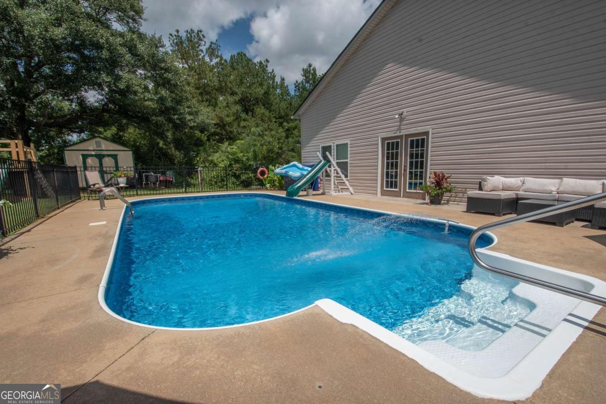 737 John Lovelace Road LaGrange, GA 30241 - Photo 31 of 46 a view of a swimming pool with a patio