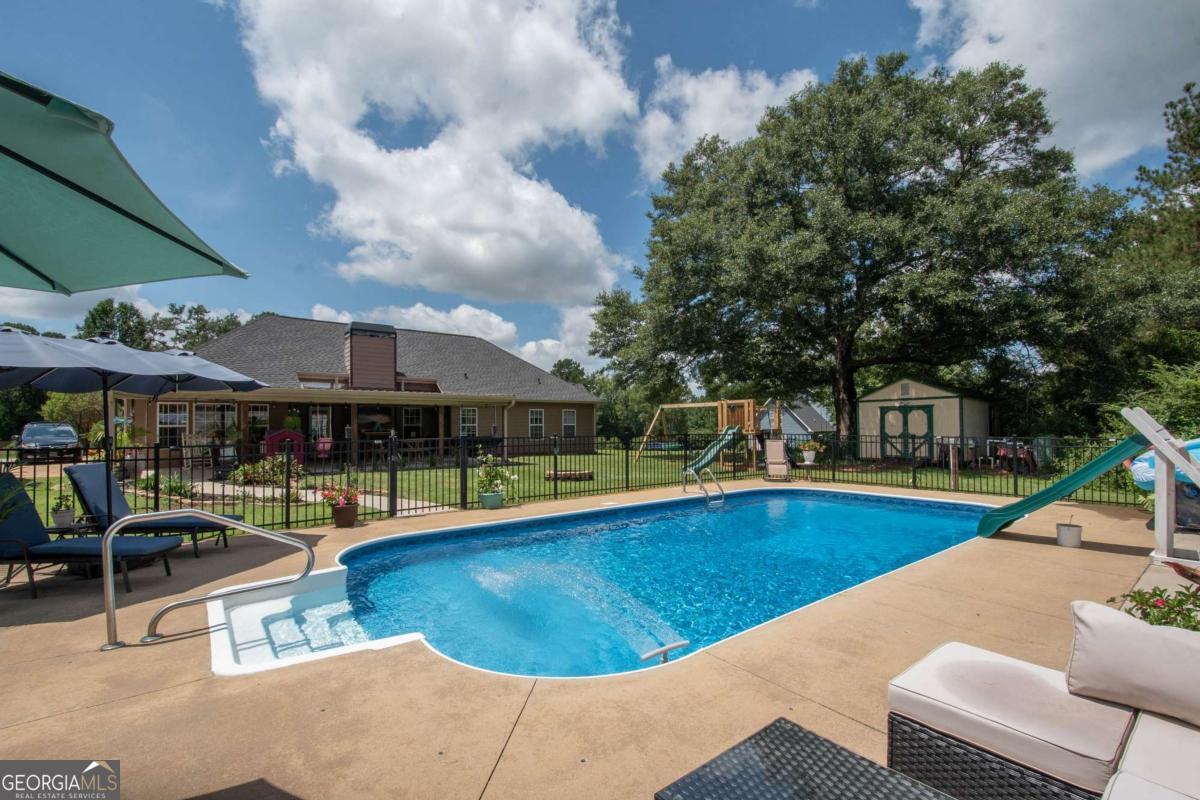737 John Lovelace Road LaGrange, GA 30241 - Photo 32 of 46 an outdoor space with swimming pool and furniture