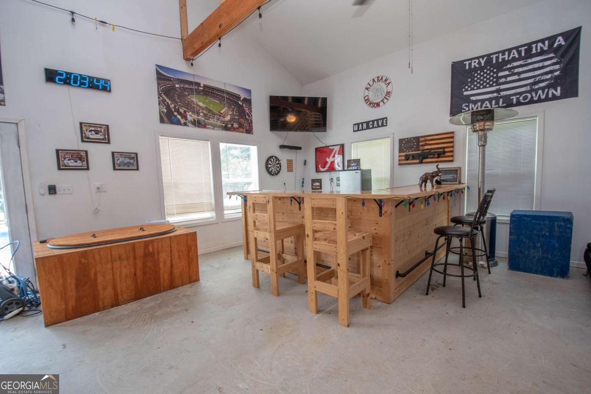 737 John Lovelace Road LaGrange, GA 30241 - Photo 37 of 46 a living room with furniture and a flat screen tv