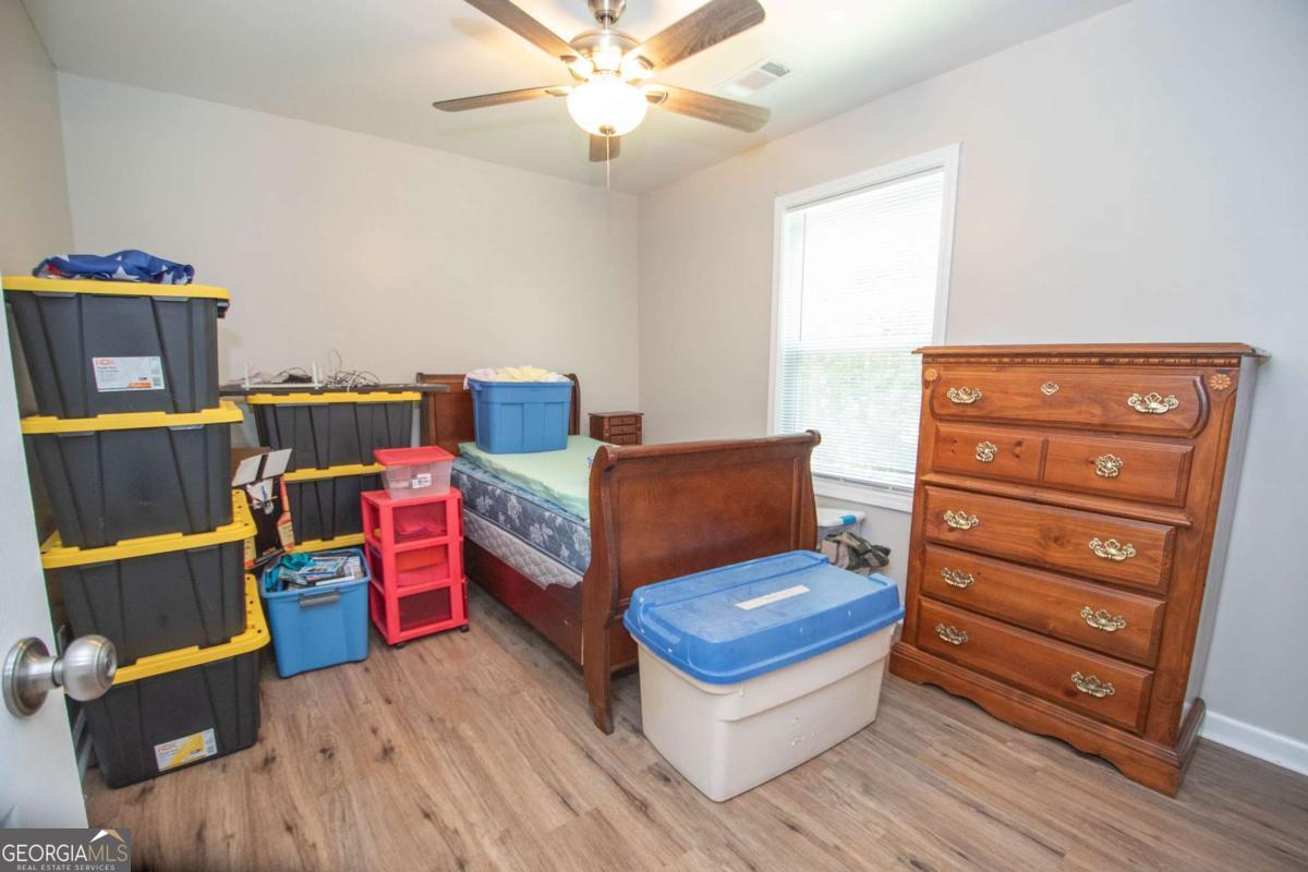 737 John Lovelace Road LaGrange, GA 30241 - Photo 42 of 46 a living room with furniture and wooden floor