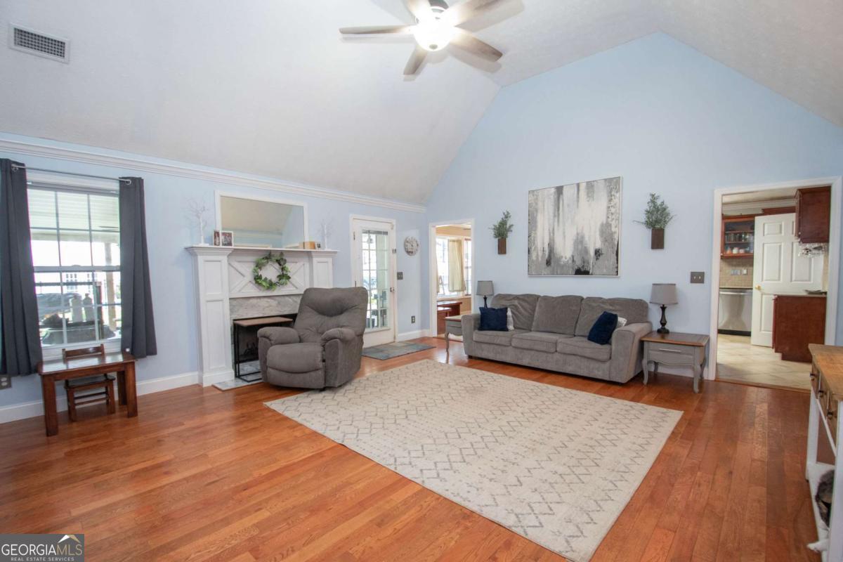 737 John Lovelace Road LaGrange, GA 30241 - Photo 6 of 46 a living room with furniture and a fireplace