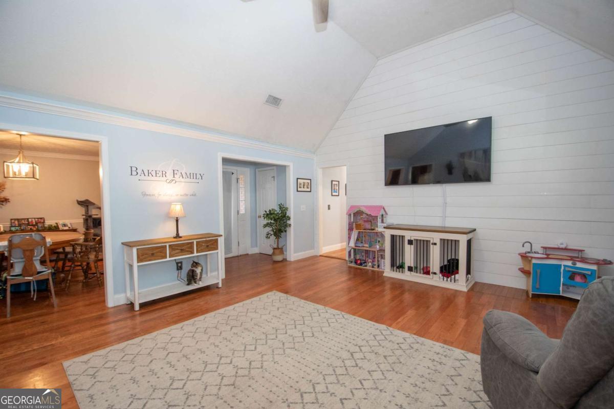 737 John Lovelace Road LaGrange, GA 30241 - Photo 7 of 46 a living room with furniture and a flat screen tv