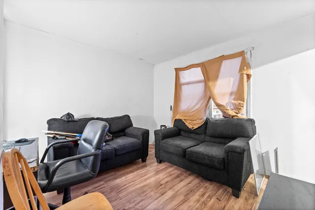 a bedroom with two beds and a walk in closet